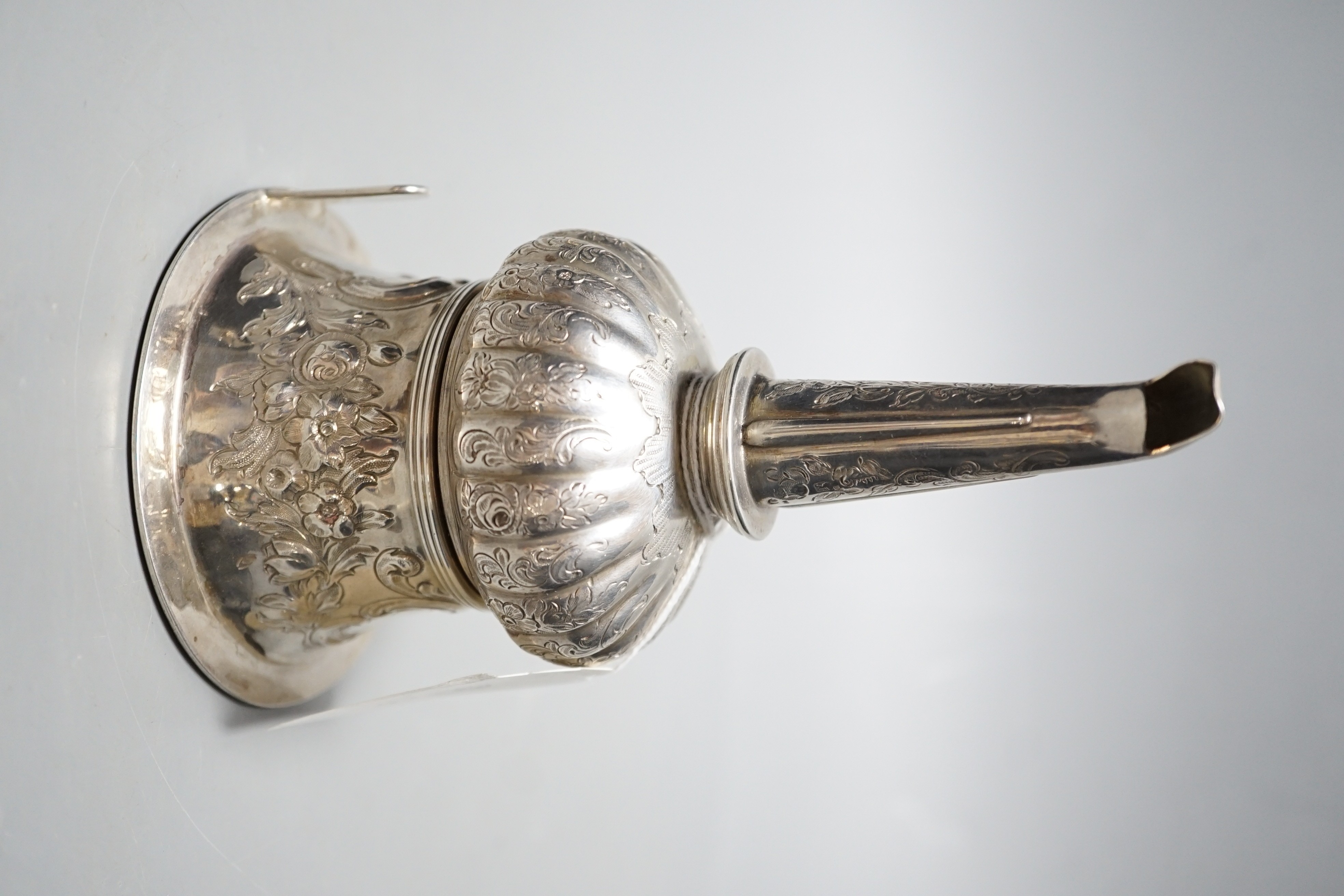 A George III silver wine funnel, with later? embossed and engraved decoration, John Watson & Son, Sheffield, 1817, 15.6cm.